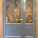 Double wooden doors in grey and crosses