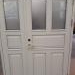 White wooden entrance doors with matted glass