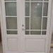 White wooden entrance doors frosted glass